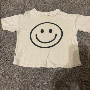 Childhoods smiley on ivory boxy tee